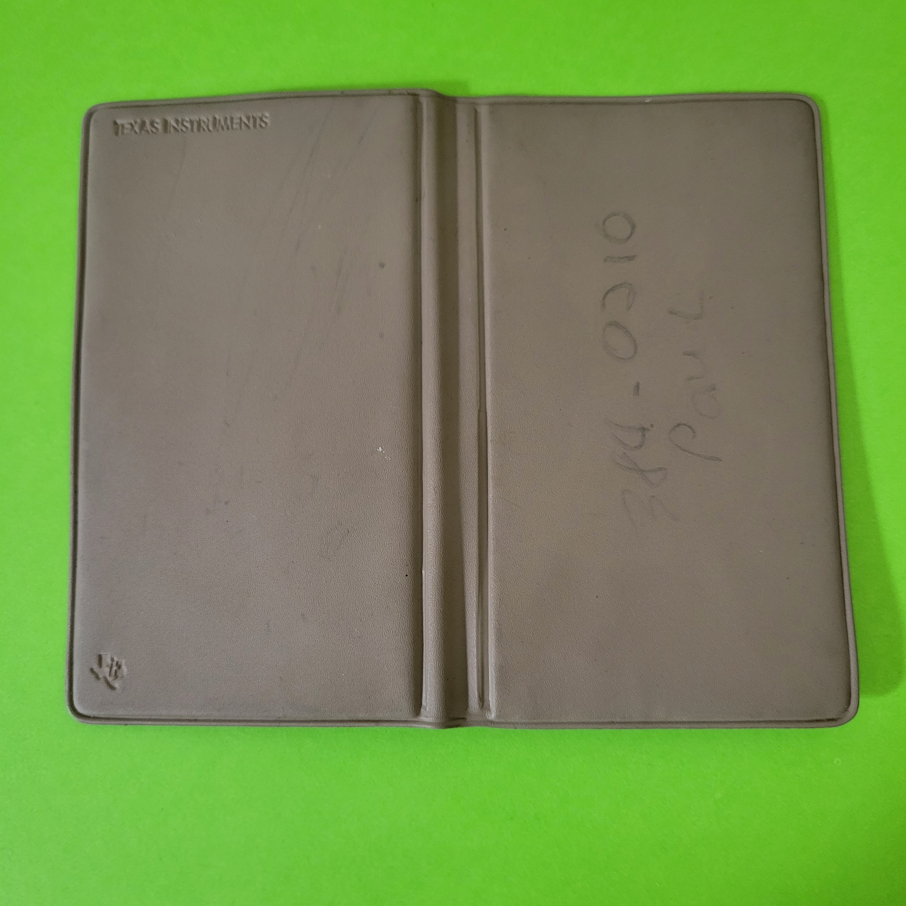 An image of the case of a ti-1706II four function plus calculator